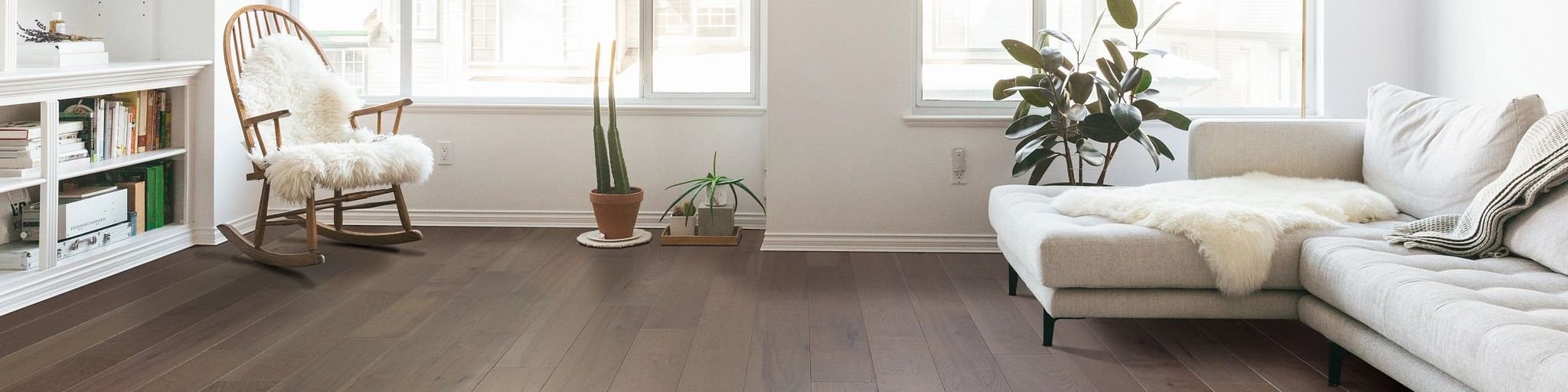 living room with hardwood floor and grey couch