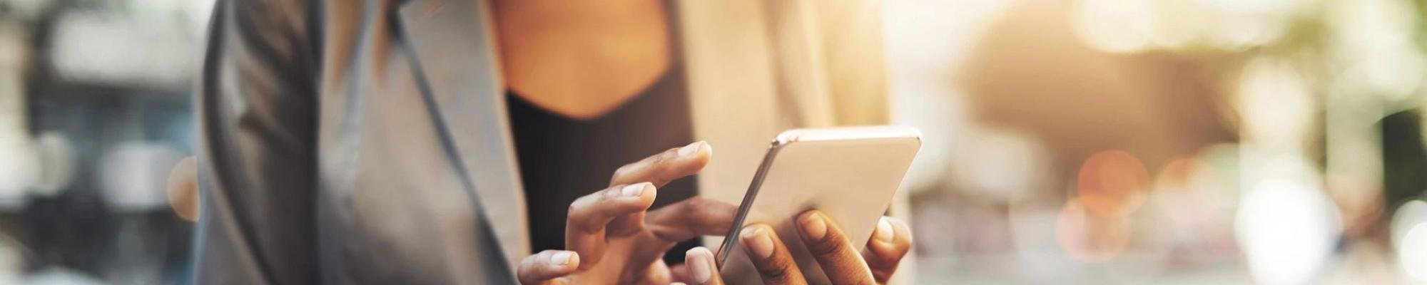 woman holding phone in hand